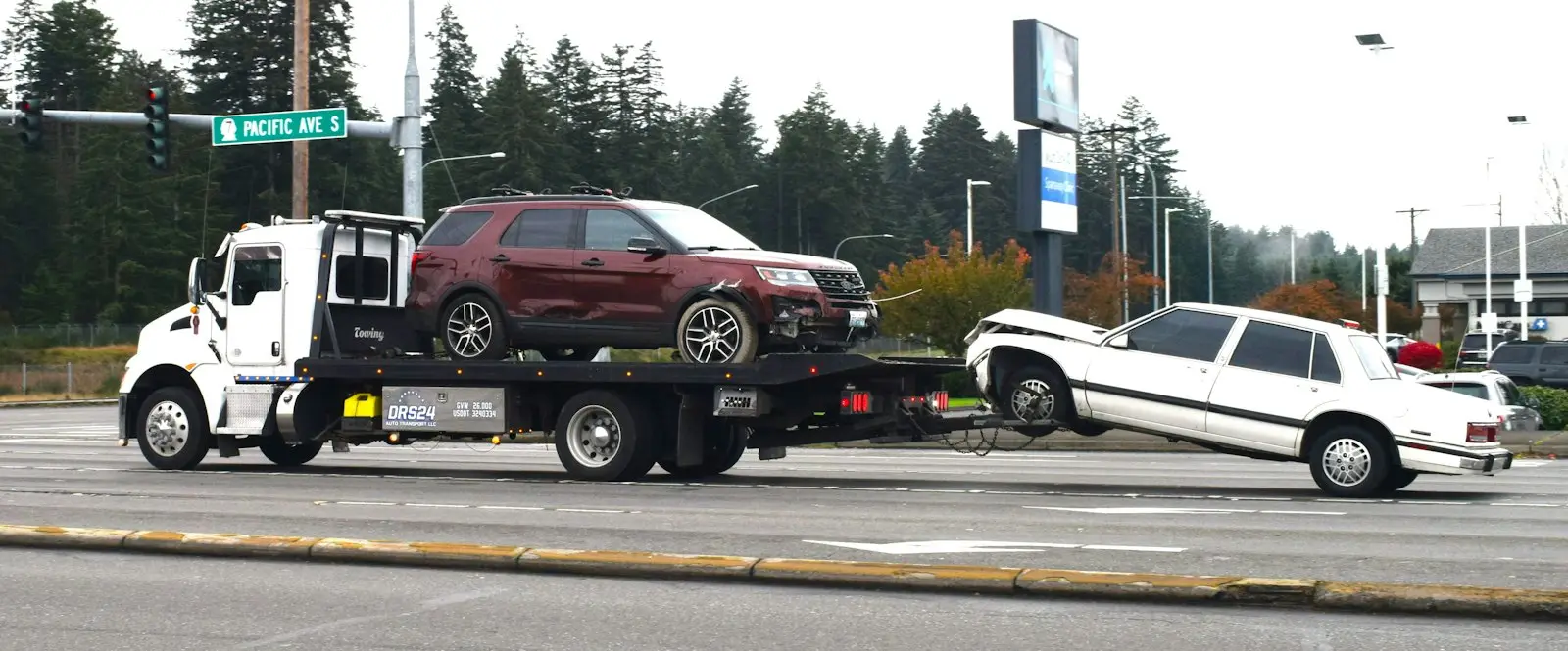 SUV loaded on a flatbed tow truck